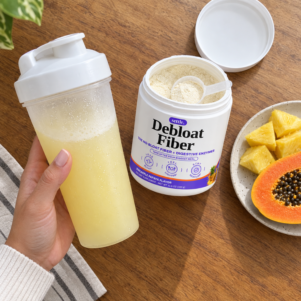 Debloat Fiber in a shaker with pineapple and papaya